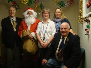 Presidnet Martin Love and Community and Vocation Chairman Clive Howells are pictured with Santa and members of Community First.